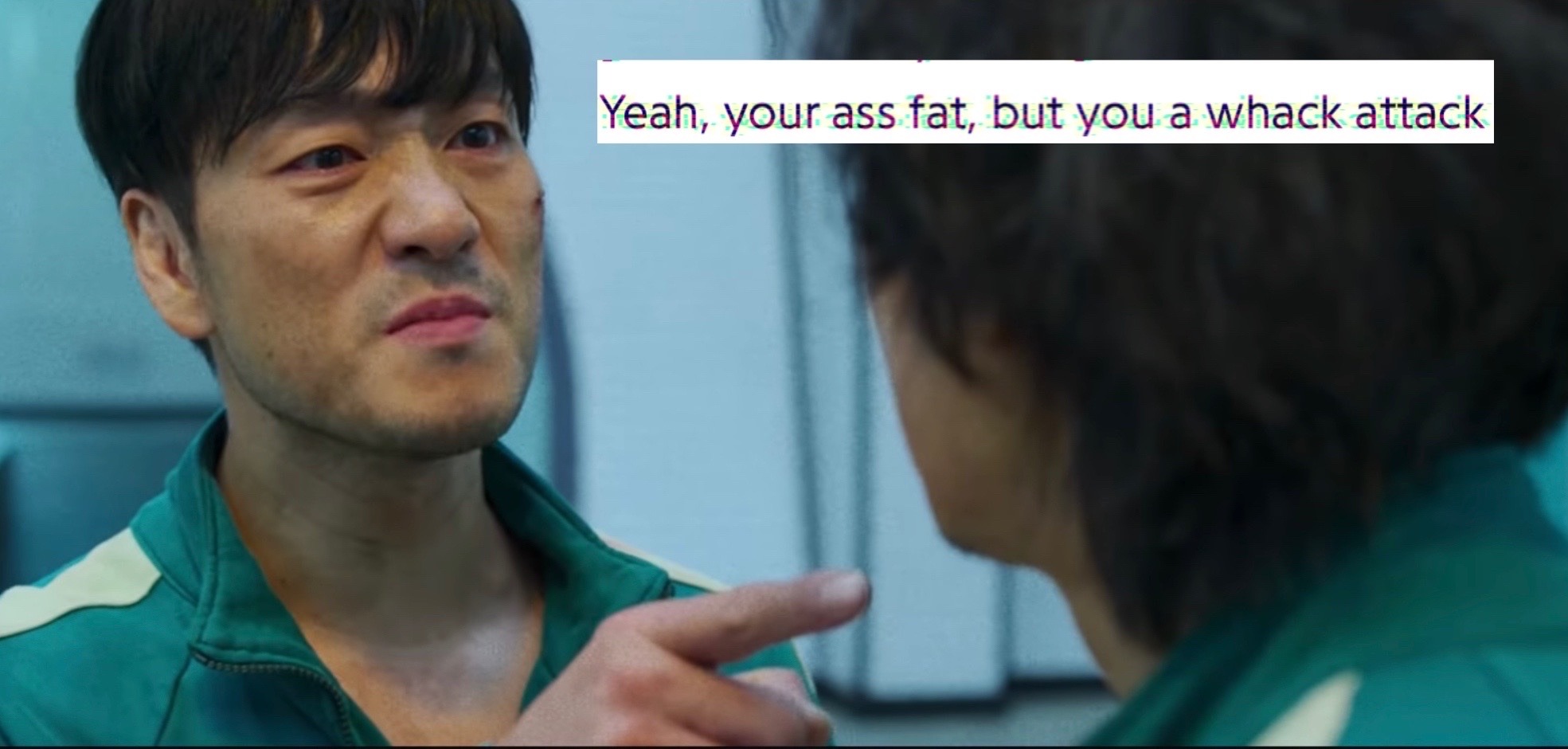 sang woo angrily pointing to gihun with the text 'yeah your ass fat but you a whack attack'
